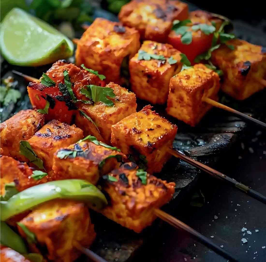 Char-grilled paneer tikka skewers with peppers and coriander