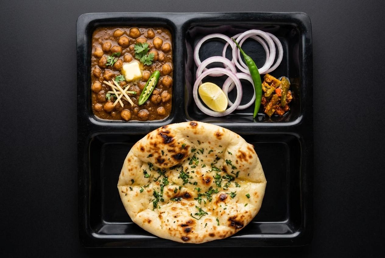 Tandoori kulcha with pindi chole, onion salad and pickle
